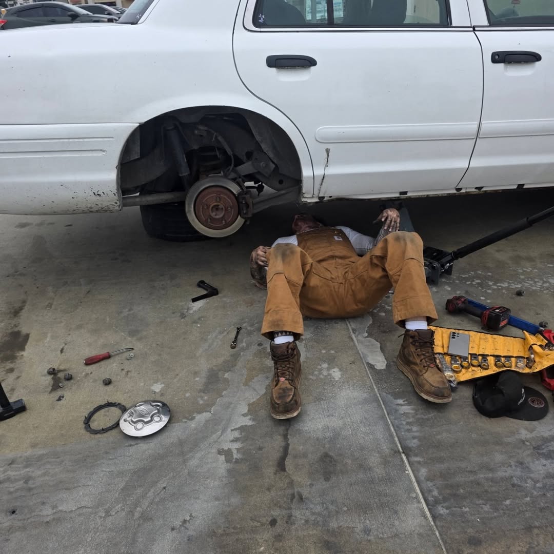 Parker repairing the rear suspension of a customer's vehicle